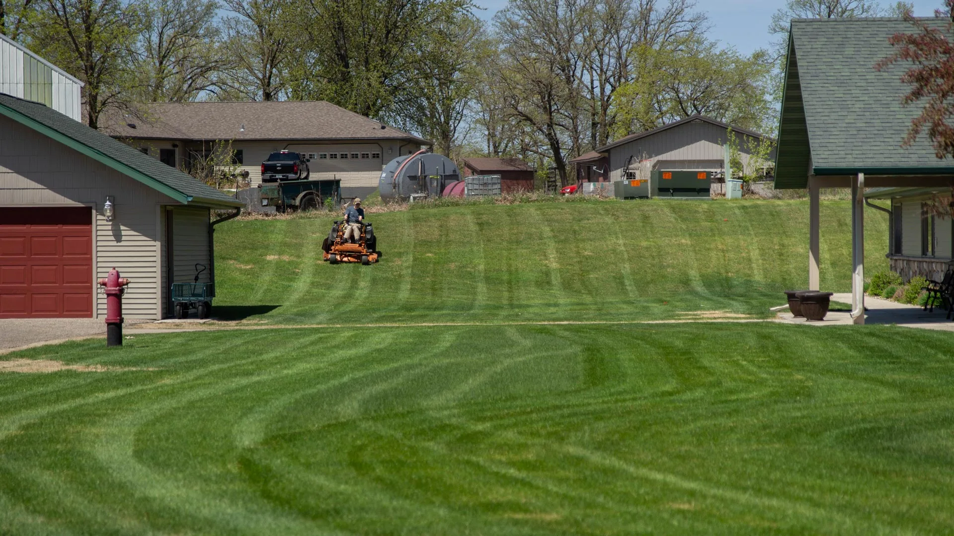 Our team member mowing a residential lawn in Shoreham, MN.