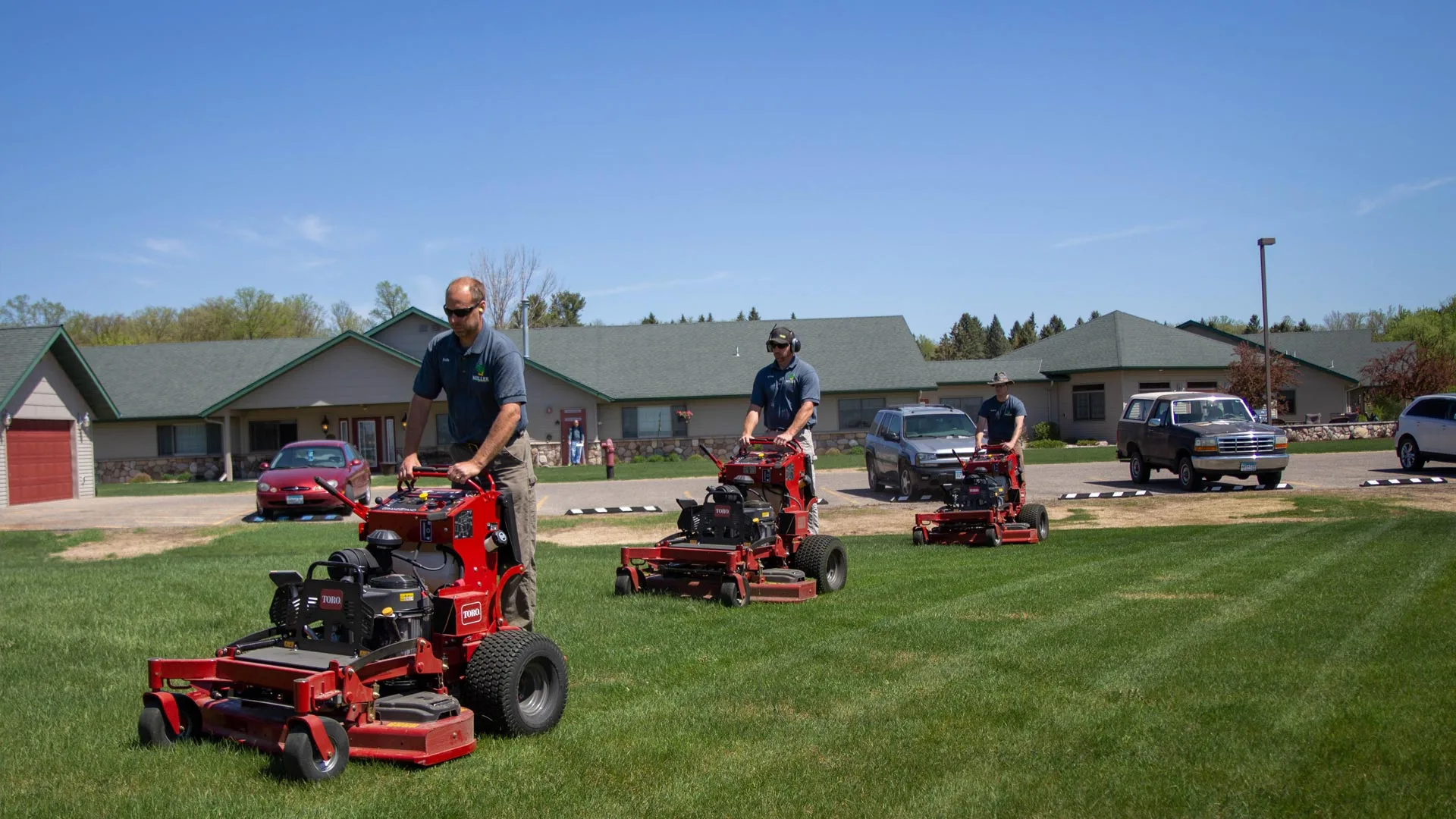 Our team of professionals mowing a large property in Detroit Lakes, MN.